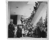 cg0049_010 - Padre. Laércio Dias de Moura, S.J., com funcionários e famílias na escadaria da Ala Kennedy, c. 1962. Fotógrafo desconhecido. Acervo Projeto Comunicar.